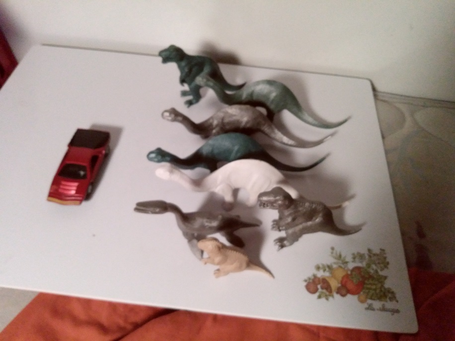 DINOSAURS ON SET WITH RED CARABO