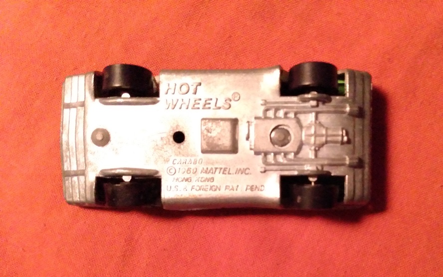 GREEN WITH ORANGE AND BLUE HOT WHEELS CARABO