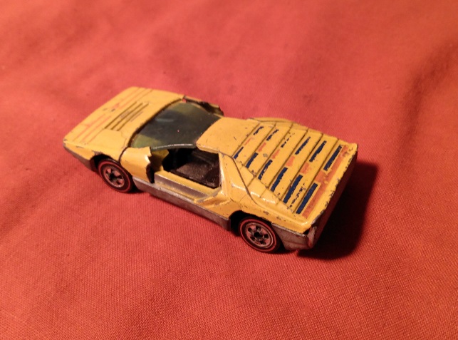 YELLOW HOT WHEELS CARABO WITH DOORS BROKEN OFF