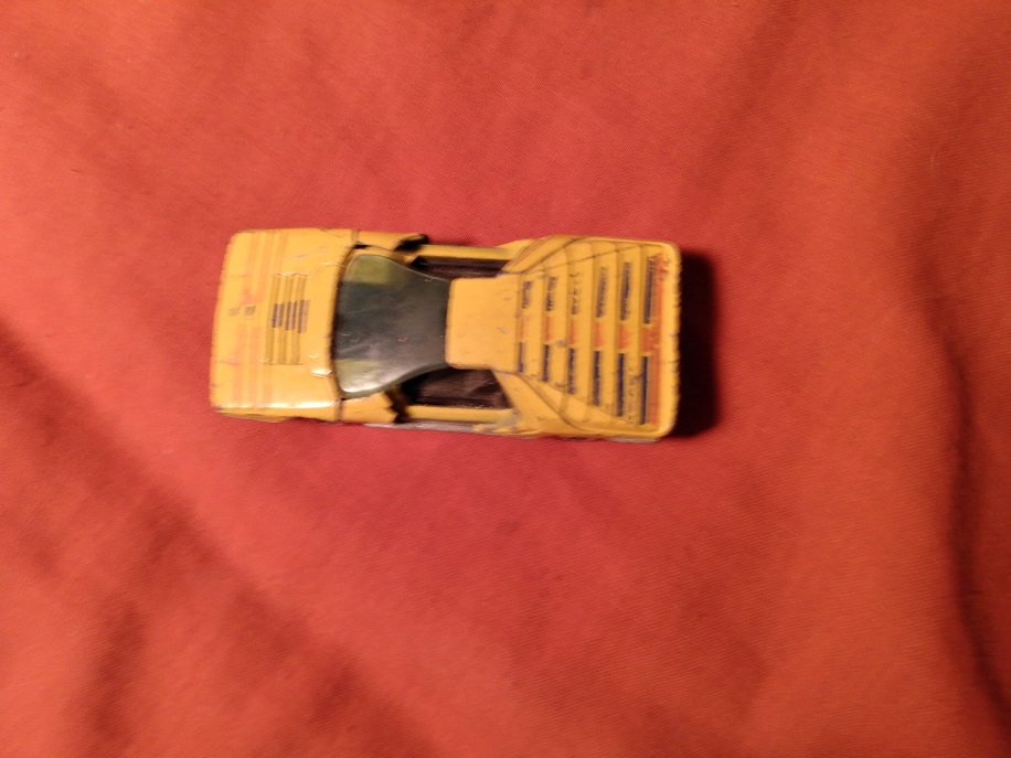 YELLOW HOT WHEELS CARABO WITH DOORS BROKEN OFF