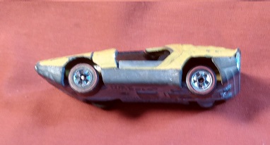 YELLOW HOT WHEELS CARABO WITH DOORS BROKEN OFF