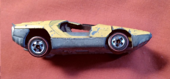 YELLOW HOT WHEELS CARABO WITH DOORS BROKEN OFF