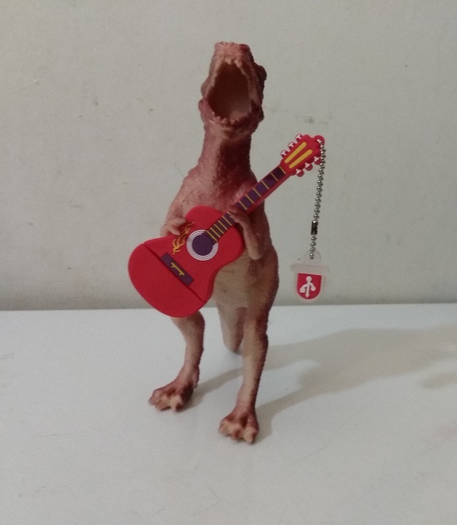 DINOSAUR PLAYING GUITAR