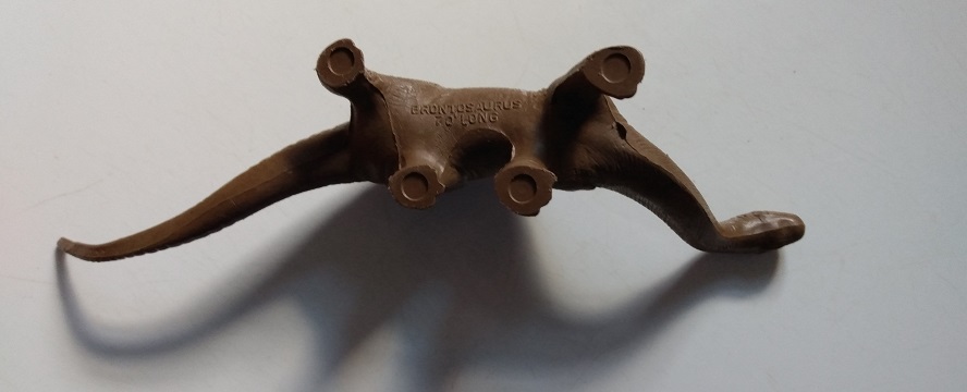 MARX CHOCOLATE MILK BROWN BRONTOSAURUS ON BACK - FEET UP LARGE CIRCLE