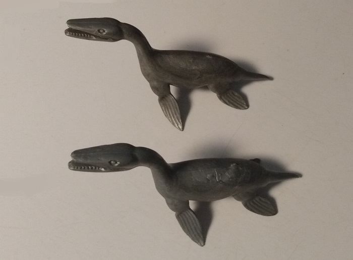 TWO SILVER MARX KRONOSAURS