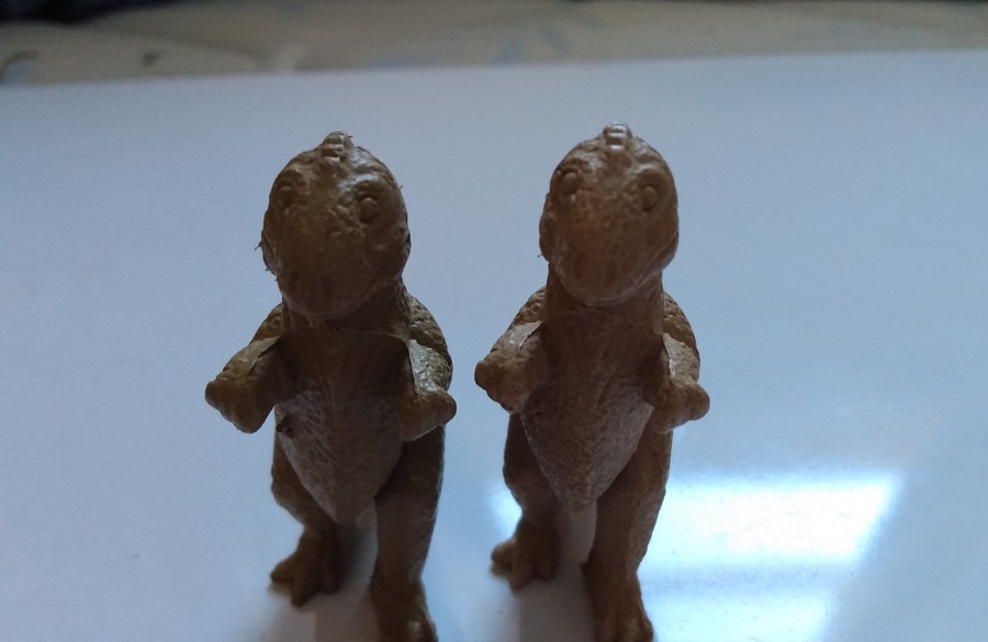 TWO TAN MARX ALLOSAURS