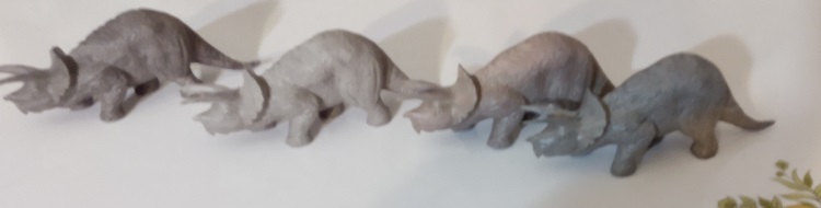 FOUR DIFFERENT GRAY TRICERATOPS