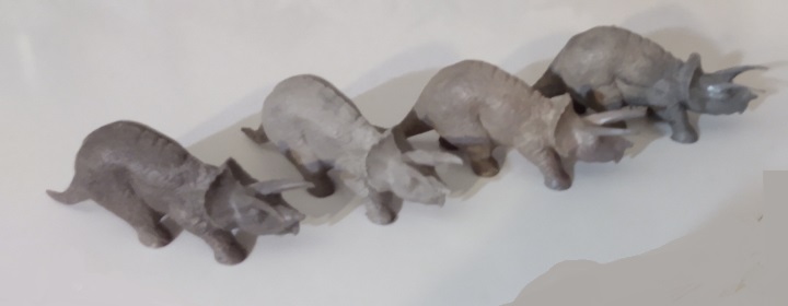 FOUR DIFFERENT GRAY TRICERATOPS