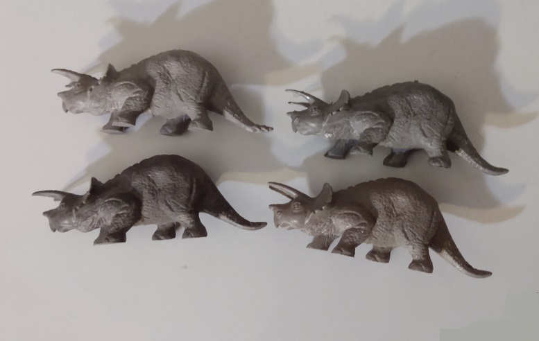 FOUR DIFFERENT GRAY TRICERATOPS