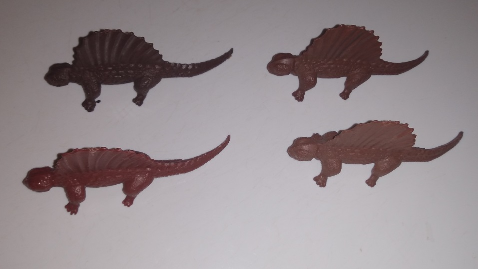 FOUR BROWN DIMETRODONS
