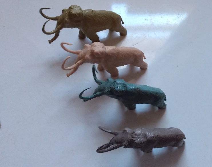 FOUR ODD COLOR MARX WOOLY MAMMOTH