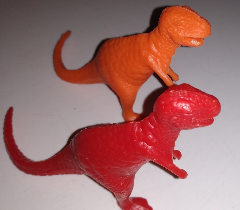 TWO MPC TYRANNOSAURS WALKING THROUGH THE WOODS.