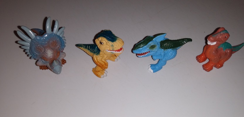 SEVEN DINO FROZ PLASTIC FIGURES DINOSAURS
