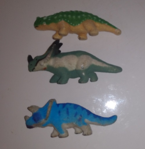 THREE FLOCKED DINOSAURS