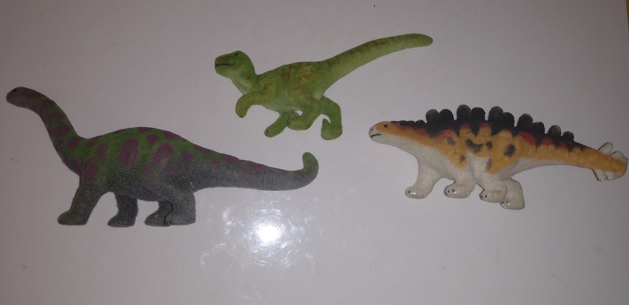 THREE FLOCKED DINOSAURS