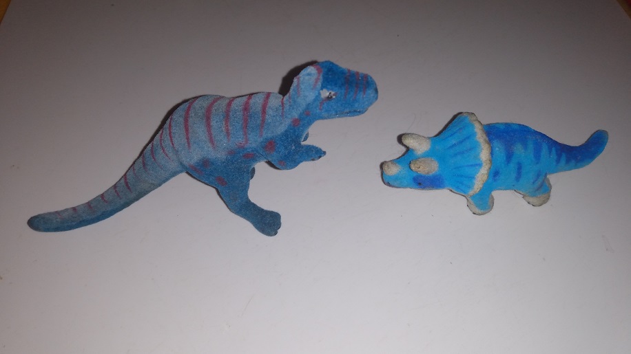 TWO FLOCKED DINOSAURS