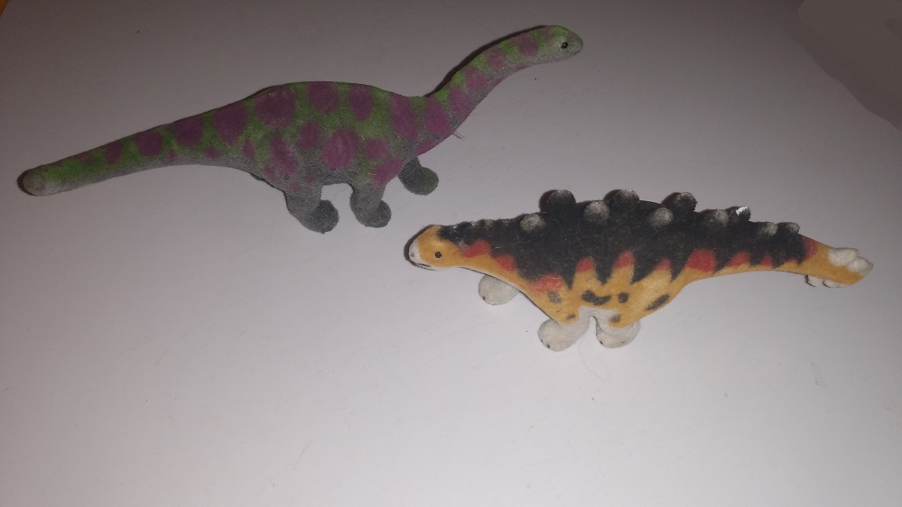 TWO FLOCKED DINOSAURS