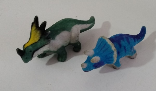 TWO FLOCKED DINOSAURS
