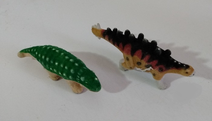 TWO FLOCKED DINOSAURS