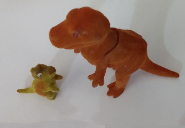 TWO FLOCKED DINOSAURS