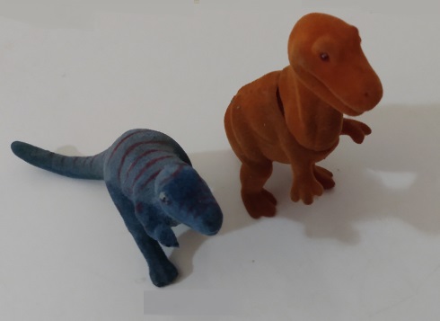 TWO FLOCKED DINOSAURS