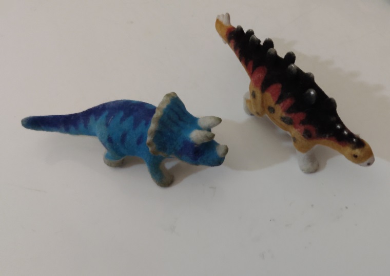 TWO FLOCKED DINOSAURS