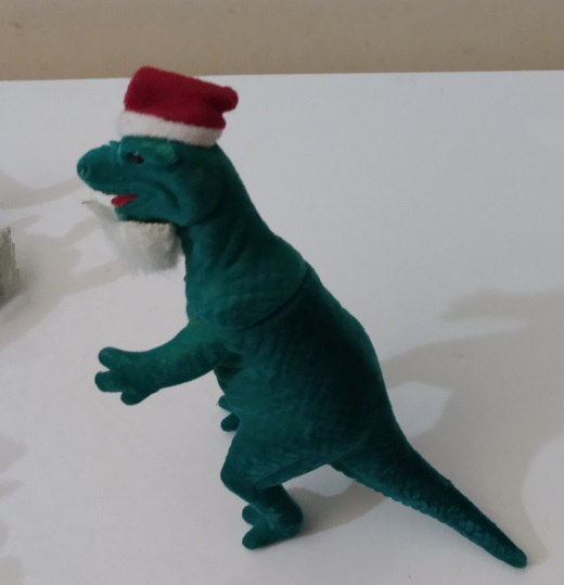 FLOCKED TYRANNOSAURUS SANTA