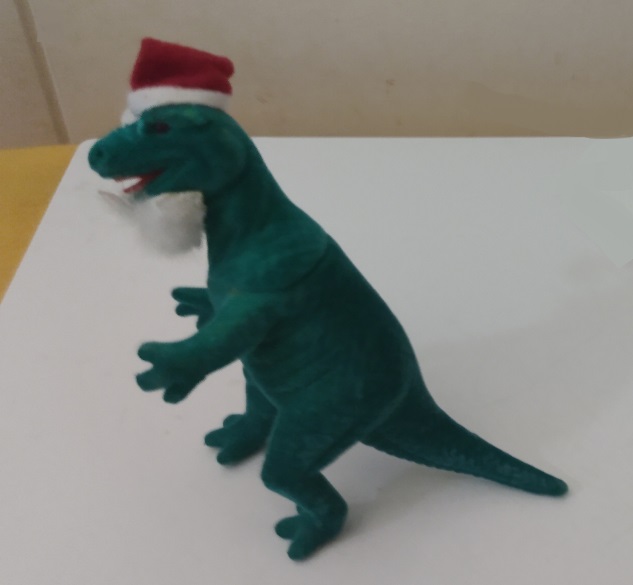 FLOCKED TYRANNOSAURUS SANTA