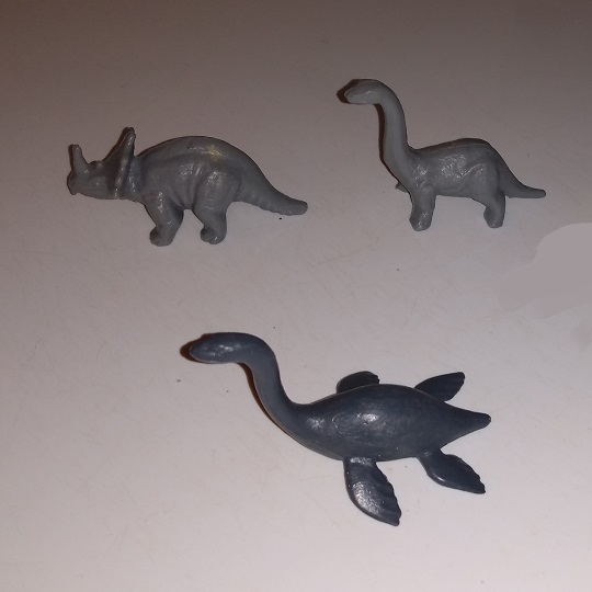 THREE KELLOGGS PLASTIC DINOSAURS