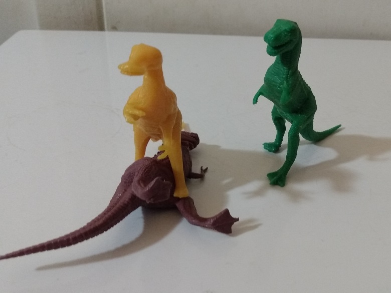 TRACHODON STANDING ON TOP OF BROWN TYRANNOSAURUS