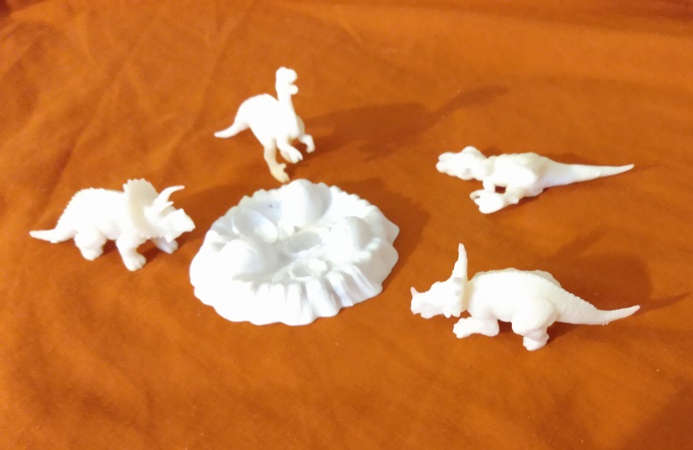 SMALL WHITE DINOSAURS AROUND NEST