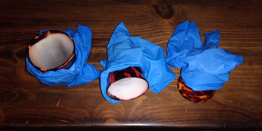 CAPS WRAPPED IN RUBBER GLOVES