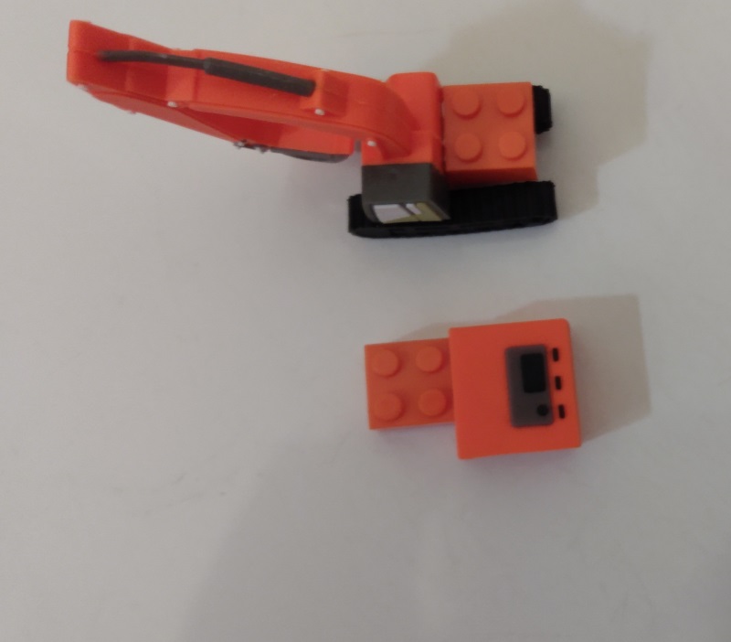 ORANGE CRANE WITH BRICK ATTATCHED